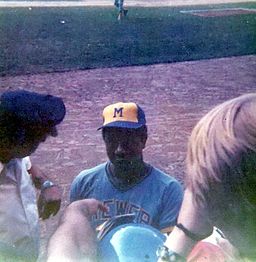 That's Hank Aaron signing for fans at Tiger Stadium, July 4, 1975. By Xnatedawgx (Own work) [CC BY-SA 3.0 (http://creativecommons.org/licenses/by-sa/3.0) or GFDL (http://www.gnu.org/copyleft/fdl.html)], via Wikimedia Commons
